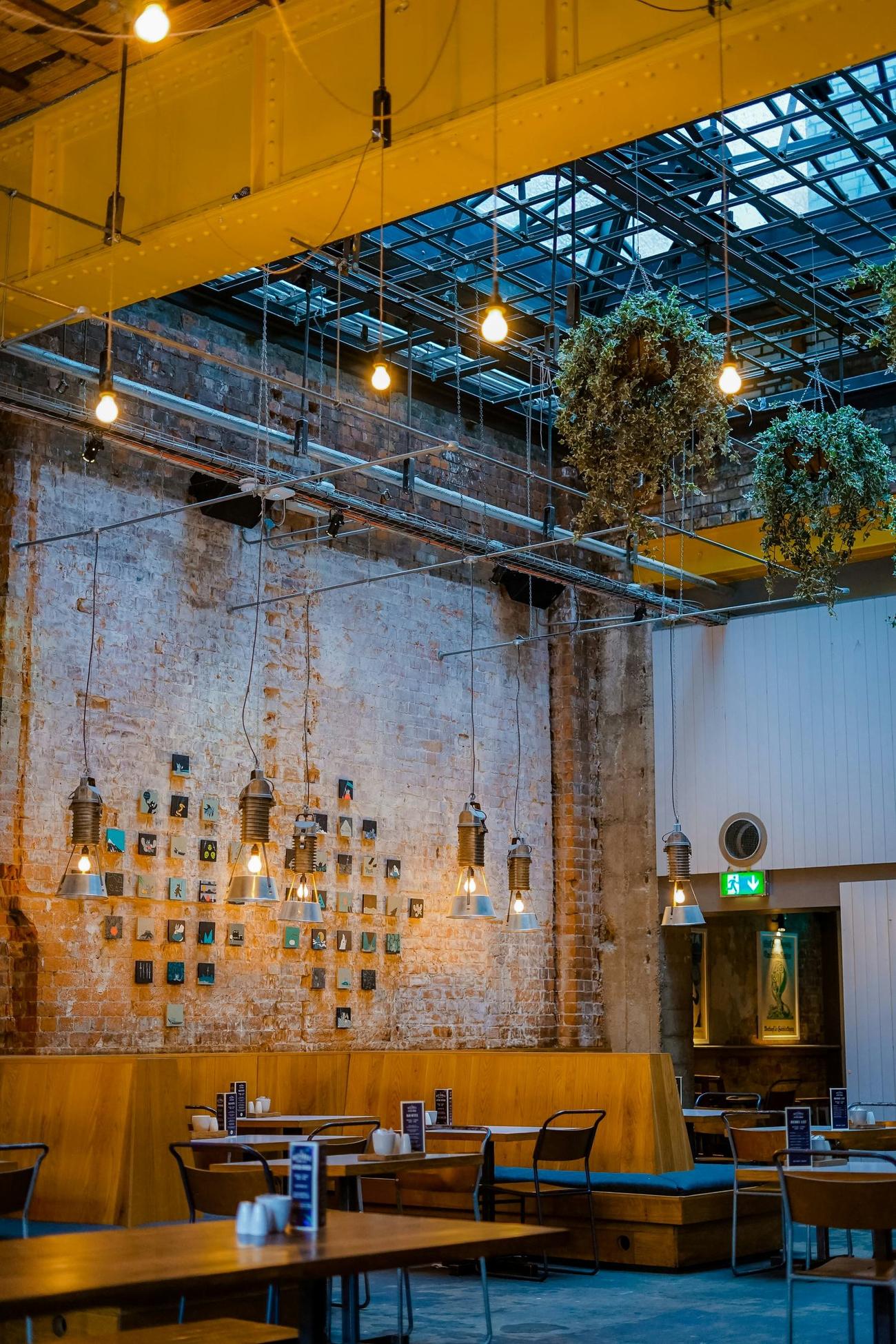 A dining room lit by hanging lanterns