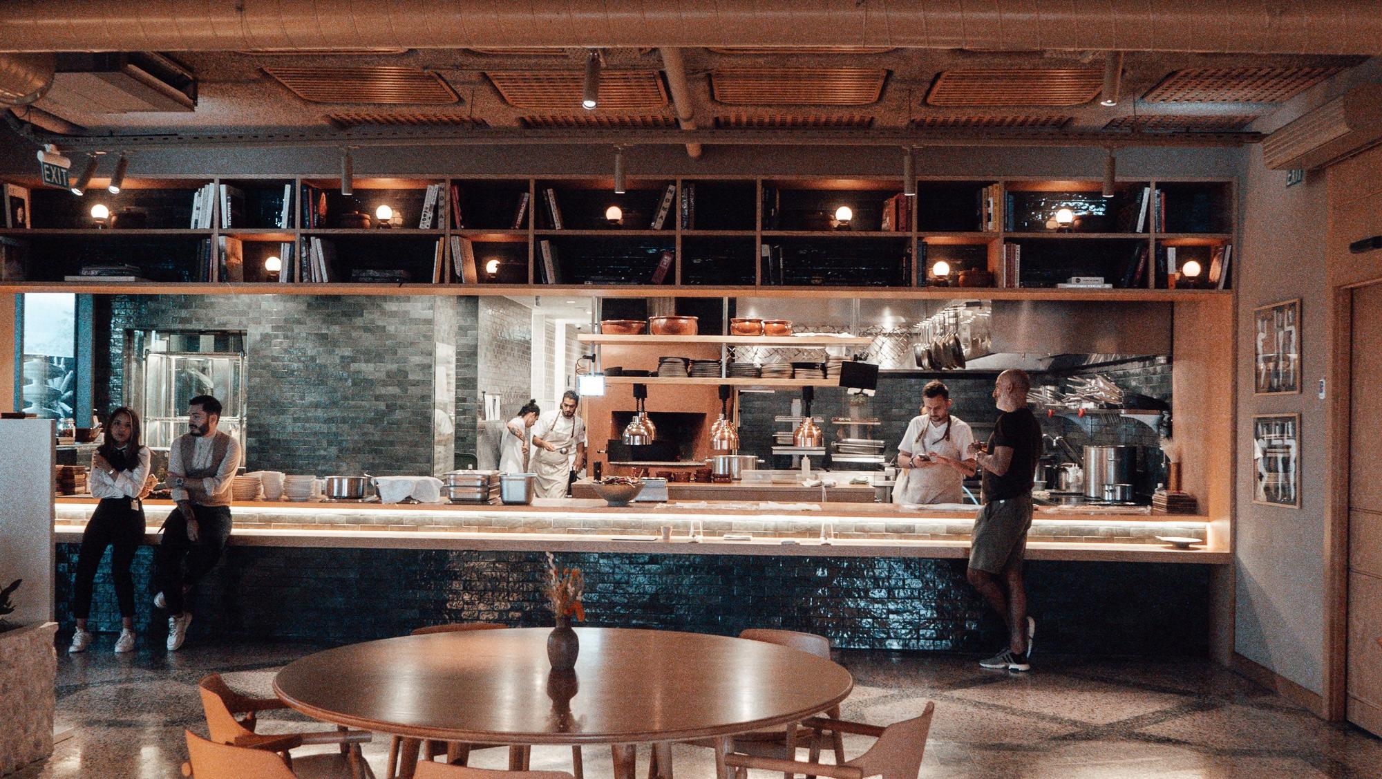 Chefs working the open kitchen pass before service