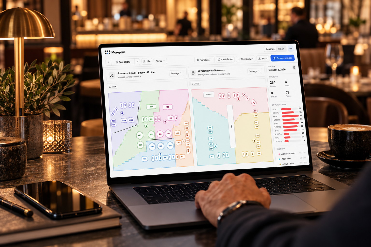 A manager reviewing tonight's Moreplan floorplan on a laptop